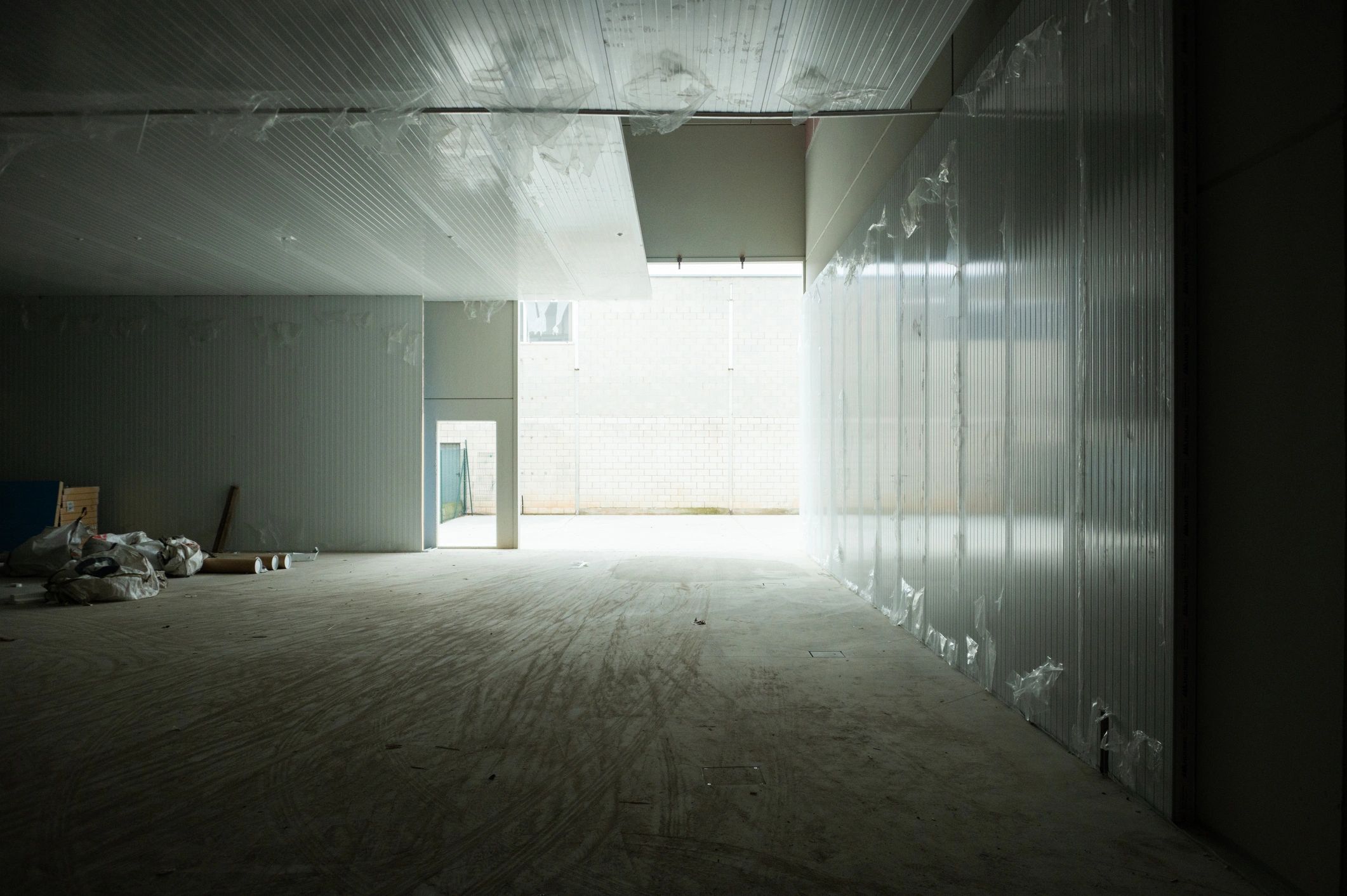Warehouse Interior with Bright Exterior Light